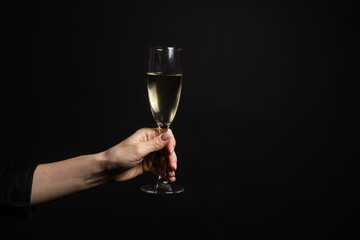 glass of champagne on black background