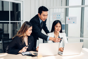 Successful business team working together in a co-working office