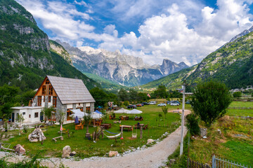 Fototapeta na wymiar Beautiful houses and cafes in the valley of Theth national park, Albania. albanian alps