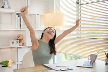Young woman Relaxing After Work, Relaxed Young woman Unwinds, Stretch oneself.