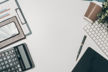 Office desk essentials top view of business objects including laptop, calculator, notebook, and pen organized workspace for success, Mock up, nobody