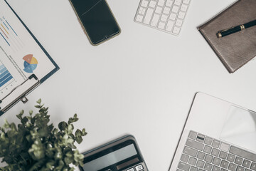 Office desk essentials top view of business objects including laptop, calculator, notebook, and pen organized workspace for success, Mock up, nobody