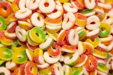 Background of colored chewy gelatin sweets, close-up.