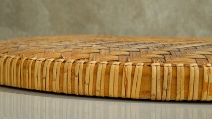 Bamboo tray on floor with abstract cement background