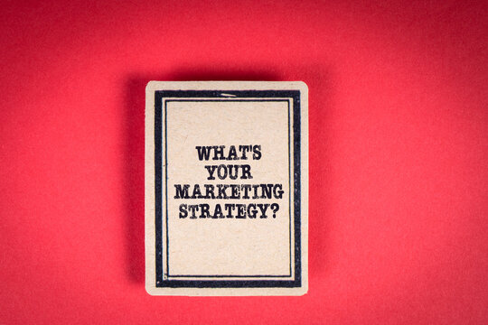 What's Your Marketing Strategy. Cardboard sticker on a red background