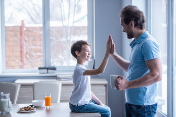 Fototapeta premium Father and son in kitchen