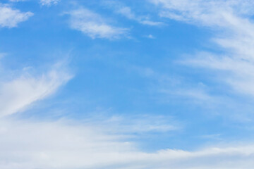 Whispy beautiful clouds at bright sunny day. Atmosphere background
