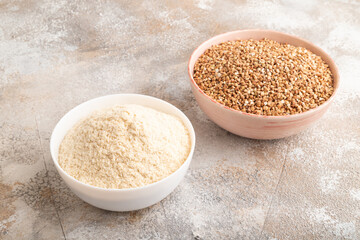 Powdered milk and buckwheat baby food mix, on brown concrete, side view