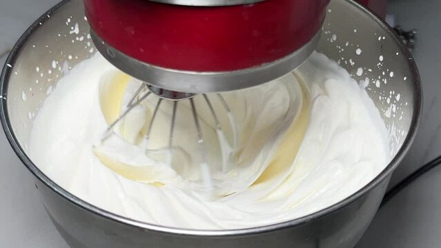 Whipped cream. Close-up of machine making whipped cream