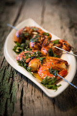 tasty fresh shrimp skewers on plate