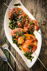 tasty fresh shrimp skewers on plate