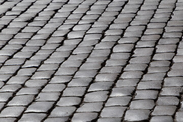 view on black and white cobblestone pavement