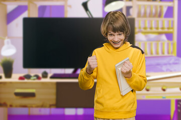 Portrait of happy cheerful teenager boy posing with notebook at home, Homework hustle: Smiling...