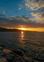 Corse (France) - Corsica is a big touristic french island in Mediterranean Sea, with beautiful beachs and mountains. Here a view of the historical center of Saint Florent port village at sunset
