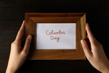 Columbus Day. Wooden frame with the inscription 