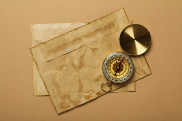 Columbus Day. Vintage compass with old envelopes