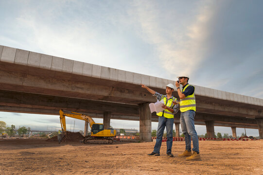 The chief civil engineer is introducing inspection of a road or expressway construction project under the road to an intern. At the expressway construction site