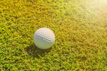 Golf ball on the green in the golf course