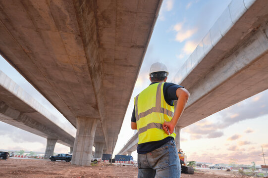 The chief civil engineer is introducing inspection of a road or expressway construction project under the road to an intern. At the expressway construction site
