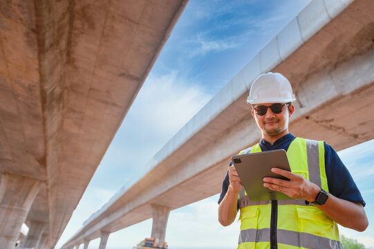 The chief civil engineer is introducing inspection of a road or expressway construction project under the road to an intern. At the expressway construction site