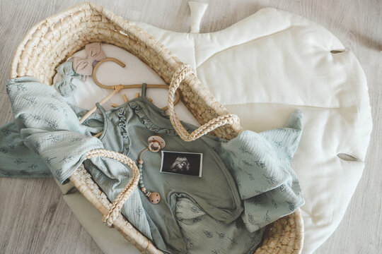 Stylish outfit for a newborn in the cradle, concept in anticipation