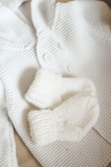 Knitted children's socks and handmade sweater