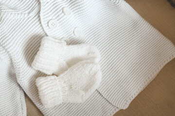 Knitted children's socks and handmade sweater