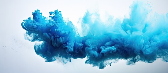 Blue powder explosion isolated on a isolated pastel background Copy space