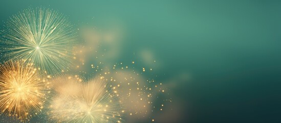 Fireworks in gold and green adorn the night sky with room for greetings Idea of celebration and special occasion isolated pastel background Copy space