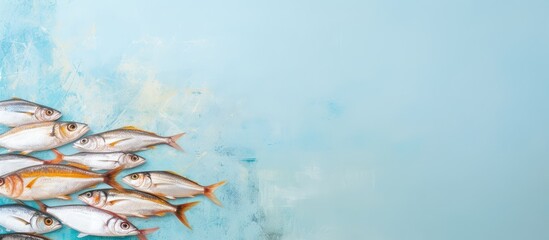 Fresh fish lined up on a isolated pastel background Copy space