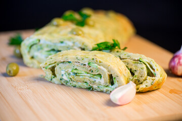 vegetable zucchini roll with garlic cheese filling inside.