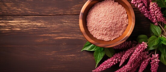 Healthy food Amaranth seeds in bowl made of wood isolated pastel background Copy space