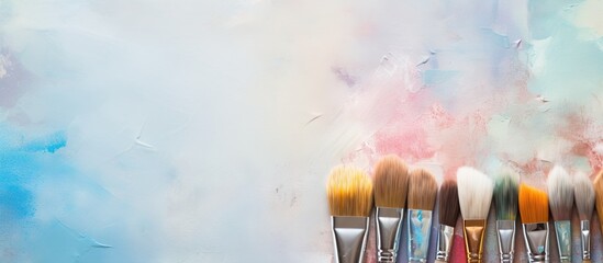 Brushes used for painting on a isolated pastel background Copy space