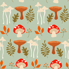 Fall Seamless Pattern with Mushrooms, Tree Branches, Berries and Leaves on a Blue Background. Natural Trendy Print.
