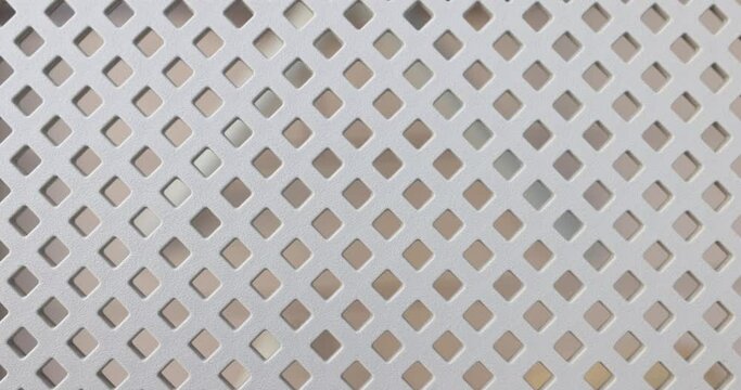 Metal mesh diagonally white lattice. Holes are diamond shaped and decorative mesh panel