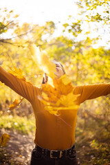 Beautiful woman in autumn park. happiness, harmony, self-care, relaxation and mindfullness