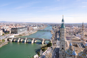Fototapeta na wymiar Horizontal aerial view of Zaragoza city including El Pilar Basilica