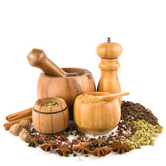 Wooden pestle, mortar, chopper and spice set isolated on white background.