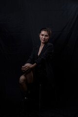 Fototapeta premium Sexy asian woman n in black lace underwear bra sexually isolated on black background.