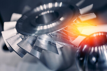 Macro steel blades of turbine propeller blue color with sunlight