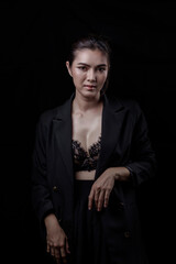 Sexy asian woman n in black lace underwear bra sexually  isolated on black background.