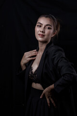 Sexy asian woman n in black lace underwear bra sexually  isolated on black background.