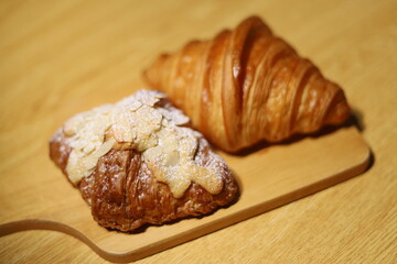 croissant on the wood plate at the kitchen