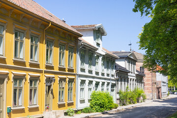 Obraz premium Happy walking in old city of Fredrikstad, on a great warm summer day, with many old buildings, Norway