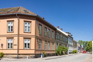 Fototapeta premium Happy walking in old city of Fredrikstad, on a great warm summer day, with many old buildings, Norway