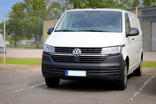 White Volkswagen Multivan T6 Parked on a Yard. Photographed in Salo, Finland, August 2023. 