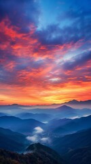 Obraz premium A beautiful sunset over a valley with mountains in the background