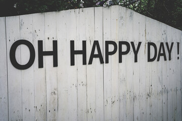 Inscription Oh Happy Day with on old wooden background. Vintage style
