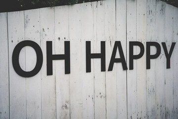 Inscription Oh Happy with on old wooden background. Vintage style