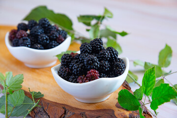 Wild berries in their natural state on a wooden cutting board